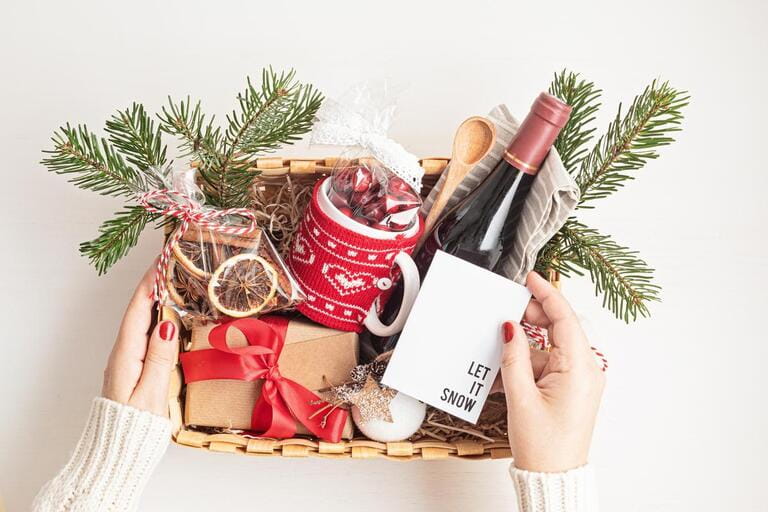 Refined Christmas gift basket for culinary enthusiats with bottle of wine and mulled wine ingredients. Corporate hamper or personal present for cooking lovers, foodies and gourmands. Refined Christmas gift basket for culinary enthusiats with bottle of wine and mulled wine ingredients. Corporate hamper or personal present for cooking lovers, foodies and gourmands.