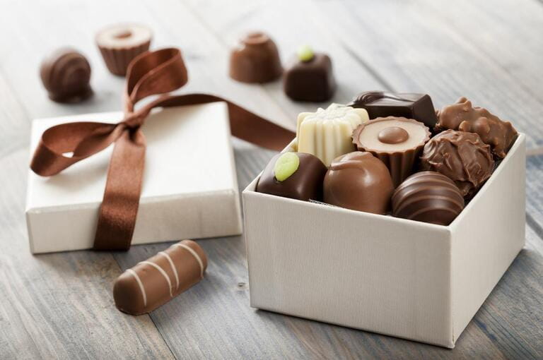 assorted chocolate confections in their gift boxes