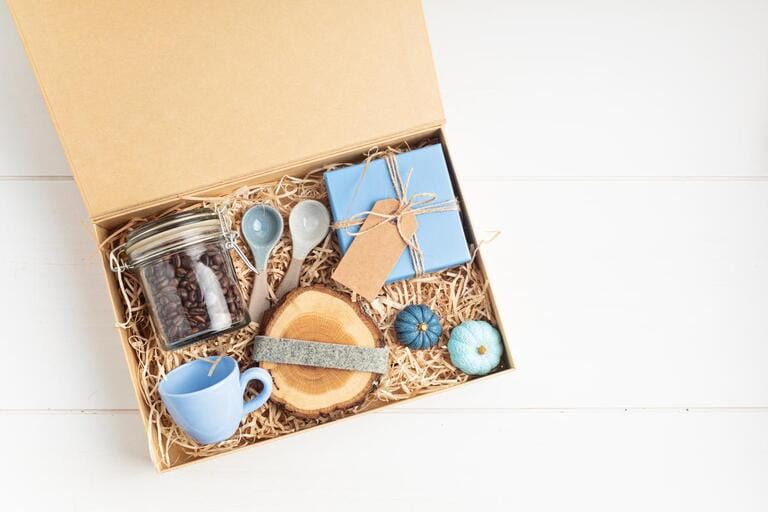 Preparing care package, seasonal gift box with plastic free, zero waste products for coffee lovers Preparing care package, seasonal gift box with plastic free, zero waste products for coffee lovers