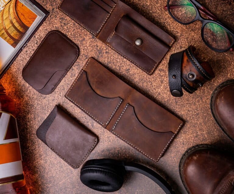 Brown leather wallets and cardholders,Boots,Headphones,Flat lay Brown leather wallets and cardholders,Boots,Headphones,Flat lay