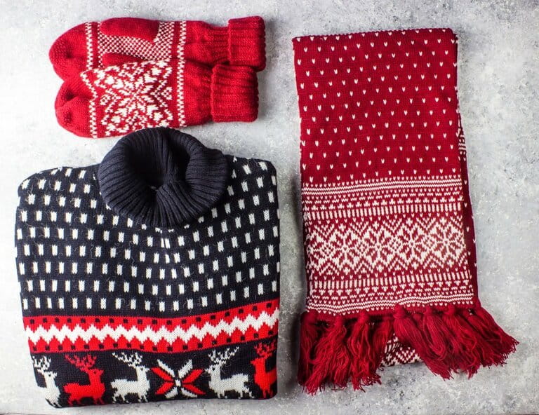 Christmas sweaters, scarves and gloves with patterns