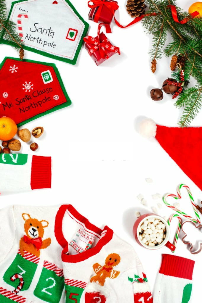 Christmas background. Ugly Christmas sweater, letter to Santa, Cristmas decoration and cup of hot chocolate