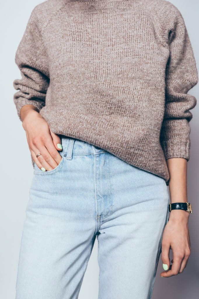 Young girl wearing oversized brown sweater